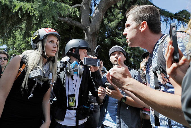 Demonstrators sharing opposing views argue during a rally Thursday in Berkeley, California. 
