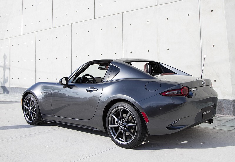 This photo provided by Mazda Motor Corporation shows the Mazda MX-5 Miata RF. Car shoppers who longed for a Mazda Miata coupe have a new choice for 2017, the new Mazda MX-5 Miata RF, with a targa-looking, power hard top. 