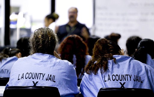 Inmates listen during a program at the Twin Towers Correctional Facility Thursday, April 27, 2017, in Los Angeles. One of the world's largest jail complexes is located in Los Angeles and within it resides perhaps the world's largest group of inmates whose mental illness is attributed to drug abuse, mainly from highly addictive methamphetamine. 