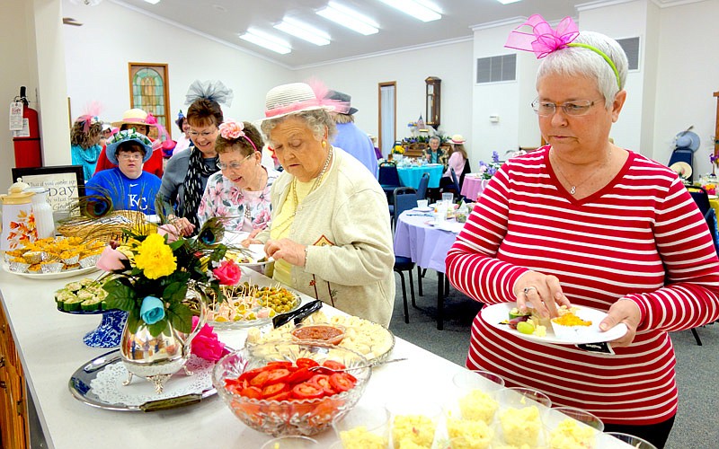 Attendees of the United Methodist Women's third annual spring brunch donned elaborate
hats and enjoyed tea and dainty finger-foods.