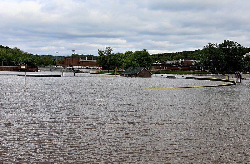 Floodwater from the Meramec River covers some athletic fields at Eureka High School on Monday, May 1, 2017, in Eureka, Mo. During the January 2016 flood Meramec River floodwater encroached on the school's buildings and ruined the gym floor. School employees are sandbagging around the building to try and keep the water out this time.