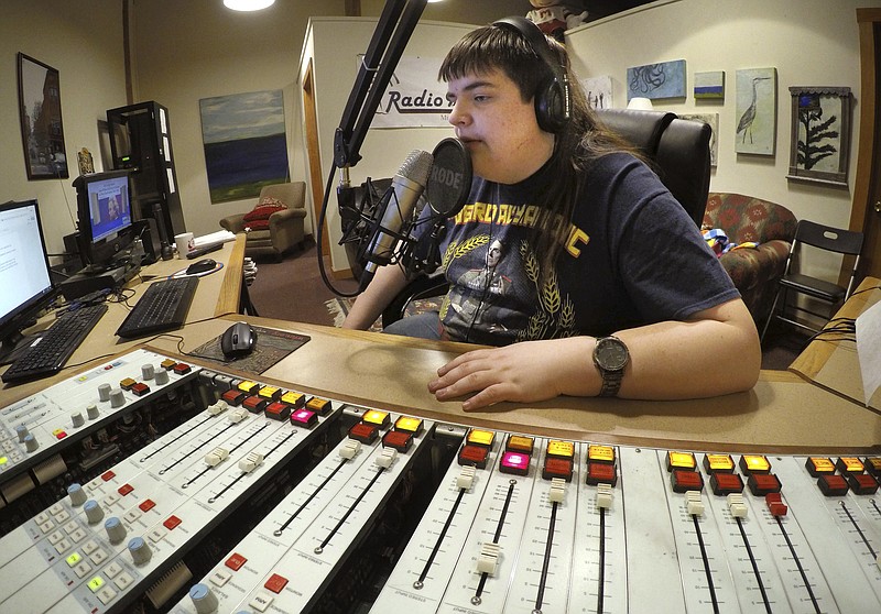 In this March 18, 2017 photo, Chaz Wing records the weather forecast at a radio station in Brunswick, Maine. Wing has testified that he was raped by other kids three times in junior high, even after repeatedly complaining of harassment to teachers and administrators. Chaz's saga is more than a tale of escalating bullying. Across the U.S., thousands of students have been sexually assaulted, by other students, in high schools, junior highs and even elementary schools _ a hidden horror educators have long been warned not to ignore.