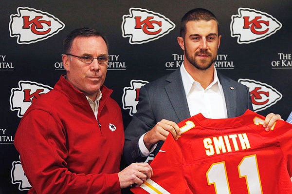 In this March 13, 2013, file photo, Chiefs general manager John Dorsey stands with newly signed quarterback Alex Smith following a news conference in Kansas City. The Chiefs used their No. 1 pick on Patrick Mahomes with the plan for him to be Smith's successor down the road.