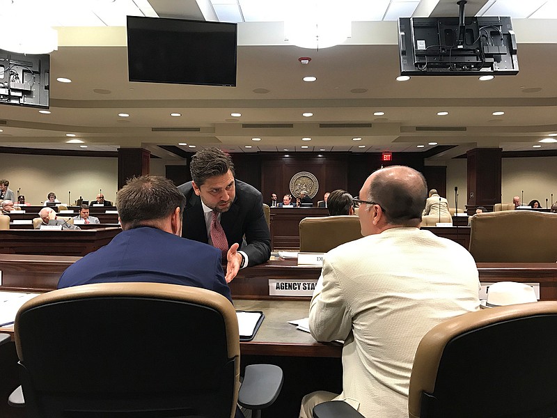 Senate President Jonathan Dismang speaks to officials from the state Department of Finance and Administration as the Joint Budget Committee meets on Tuesday, May 2, 2017, in Little Rock, Ark. Arkansas lawmakers gave initial approval Tuesday to legislation that would move 60,000 off the state's hybrid Medicaid expansion and impose a work requirement on some participants. A special session to take up the proposed changes is expected to end Wednesday. 