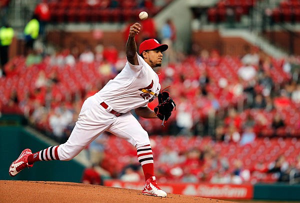 Cardinals starting pitcher Carlos Martinez throws during the first inning of Tuesday night's game against the Brewers at Busch Stadium in St. Louis.