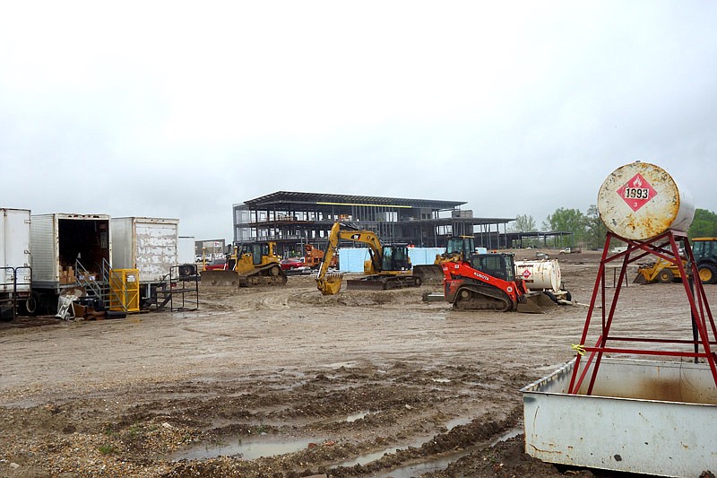 In this photo published May 7, 2017, workers at Fulton State Hospital work through brisk breezes and steady rain as construction on the new facilities nears the two-year mark.