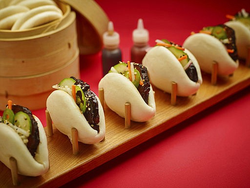 This April 28, 2017 photo provided by The Culinary Institute of America shows pork belly steamed buns in Hyde Park, N.Y. (Phil Mansfield/The Culinary Institute of America via AP)