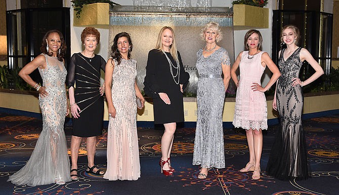 From left to right, Theressa Ferguson, Mary Jane Luebbering, Carie Tergin, Jennifer Tergin, Roni Flood, Heather Pirner and Kiley Williams model clothing provided by Saffees. Fashion and food were once again on the menu Monday for this year's annual Cole County Historical Society Fashion Show and Luncheon held at the Capitol Plaza Hotel.