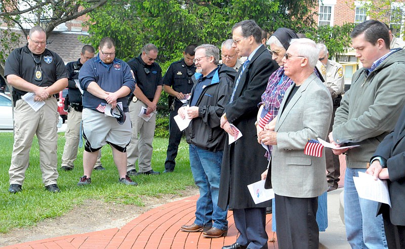 The California Ministerial Alliance led about 70 people in prayer in front of the Moniteau County Courthouse Thursday, May 4, 2017 for the National Day of Prayer.