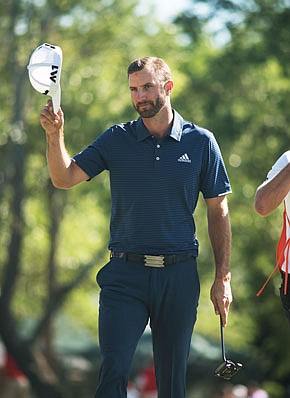 Dustin Johnson tips his hat Sunday after finishing his round at the Wells Fargo Championship in Wilmington, N.C.