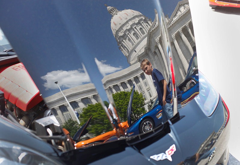 Nathan Blount, 12, walks through a row of Corvettes at the annual Corvette Classic show in front of the Missouri Capitol on Saturday afternoon, May 10, 2014.