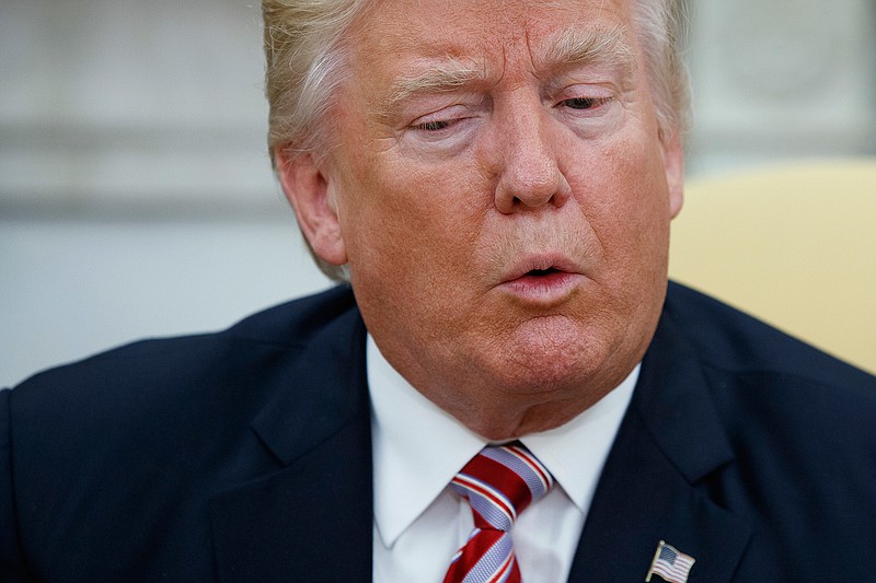 President Donald Trump talks to reporters during a meeting with Dr. Henry Kissinger, former Secretary of State and National Security Advisor under President Richard Nixon, in the Oval Office of the White House, Wednesday, May 10, 2017, in Washington. 