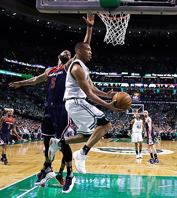 Celtics guard Avery Bradley drives to the basket against Wizards forward Markieff Morris during Wednesday night's game in Boston.