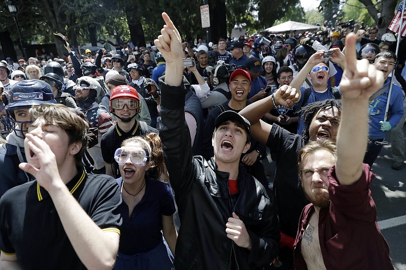 In this Thursday, April 27, 2017, file photo, demonstrators shout slogans directed at city hall during a rally for free speech near the University of California, Berkeley campus in Berkeley, Calif. Ann Coulter's speech that day was canceled amid threats of violence, the latest example of a speaker with controversial views being blocked from talking. Since the beginning of 2016, more than two dozen campus speeches have been derailed amid controversy, according to the Foundation For Individual Rights In Education, a group that monitors free speech on campuses.