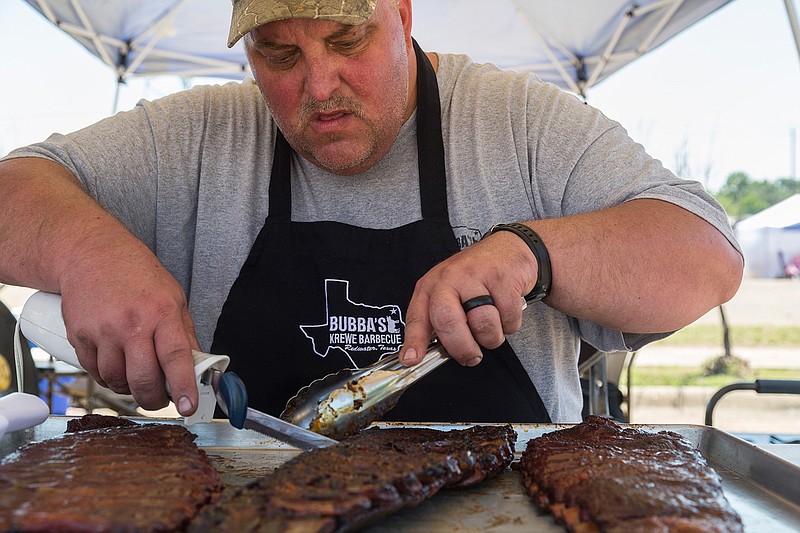 Brad Rosiek prepares St. Louis cut spare ribs for competition at last year's RailFest.