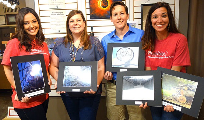 Lydia Schuster, owner of Studio Seven, left, and Kellie Pontius of Central Missouri Community Action, right, teamed up with Missouri Girls Town through PhotoVoice. Girls Town interim associate executive director Melissa Blumer, second from left, and director of operations Jenny Preiss said they are proud of the art the girls created.