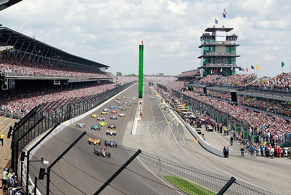 In this May 29, 2016, file photo, James Hinchcliffe leads the field into the first turn at the start of the 100th running of the Indianapolis 500 auto race at Indianapolis Motor Speedway in Indianapolis.