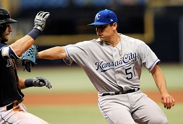 Royals starter Jason Vargas tags out Kevin Kiermaier of the Rays on a ground ball down the first base line during the fifth inning of Thursday afternoon's game in St. Petersburg, Fla. 