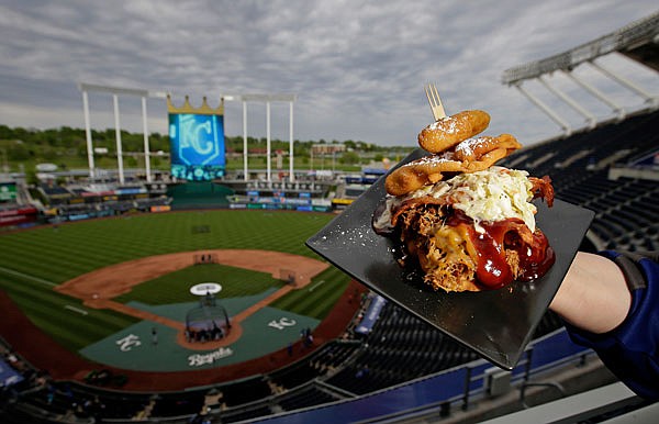 The Pulled Pork Patty Melt is seen at Kauffman Stadium before a recent game between the Royals and the White Sox in Kansas City. The sandwich features pulled pork with cheese, bacon and cole slaw between a funnel cake bun and is topped with a jalapeno.