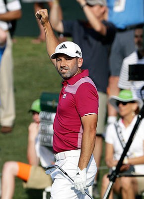 Sergio Garcia raises his arm after hitting a hole-in-one on the 17th hole during Thursday's first round of The Players Championship in Ponte Vedra Beach, Fla.