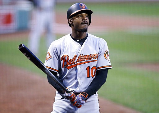 In this May 1, 2017, file photo, Baltimore Orioles' Adam Jones prepares to bat during the first inning of a baseball game against the Boston Red Sox at Fenway Park in Boston. Jones says the widely condemned racial insult hurled at him at Fenway Park illustrates the need for dialogue about race and for fans to police each other. Jones spoke Saturday, May 13, 2017, at the Negro Leagues Baseball Museum in Kansas City while his team plays a series with the Royals. 