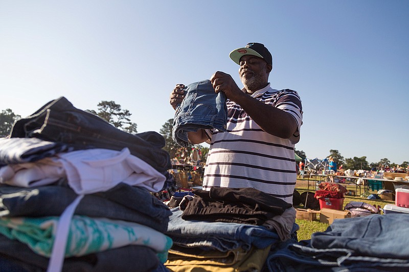 "I'm the blue-jean man," Jerry Grandy said on May 13, 2017, at the community yard sale at Spring Lake Park in Texarkana, Texas. Grandy sold clothes from his and multiple generations of his family's closets. 