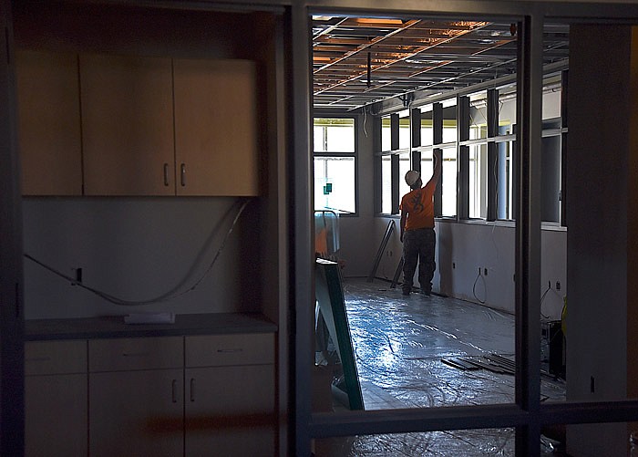 In this Nov. 29, 2016 file photo, a worker is busy on construction of Jefferson City's and Lincoln University's Wellness Center.