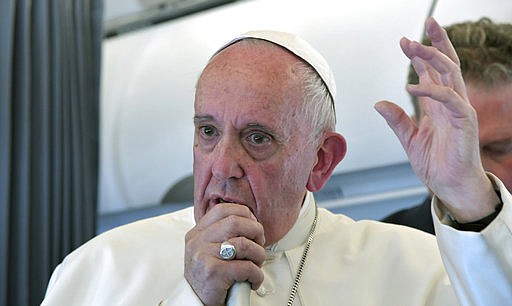 Pope Francis addresses journalists during the traditional press conference on his flight back to Rome, following a two-day visit at Fatima, Portugal, Saturday, May 13, 2017. 