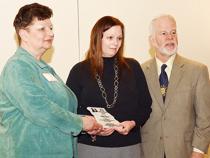 Pamela Spear, left, chair of the Missouri Alliance for Children, Youth and Families, and Pat Dougherty, present Cindy Reese, center, with a Lifetime Advocacy award April 6 during Child Advocacy Day at the Capitol. Reese works for the Department of Health and Human Services.