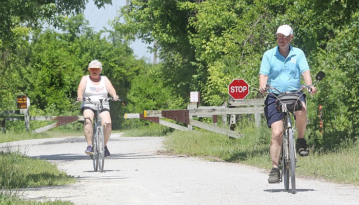Eleanor Schepers, left, and Louis Schepers enjoy morning biking Monday, May 15, 2017 on the Katy Trail near Jefferson City. 