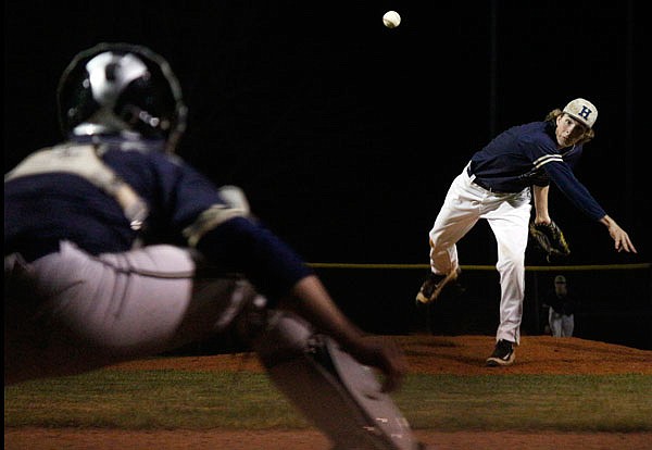 Helias pitcher Tyler Cassmeyer delivers to the plate during a game last month against Blair Oaks at the American Legion Post 5 Sports Complex. 