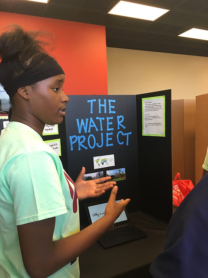 Z'niah Nelson, 14, talks about her clean water project Tuesday at the Project Based Learning Expo for Texarkana, Ark., magnet students.
