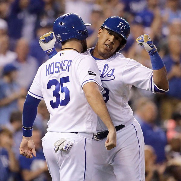 Royals teammates Eric Hosmer (left) and Salvador Perez celebrate after Perez hit a two-run home run during the fourth inning of Wednesday night's game against the Yankees at Kauffman Stadium in Kansas City.