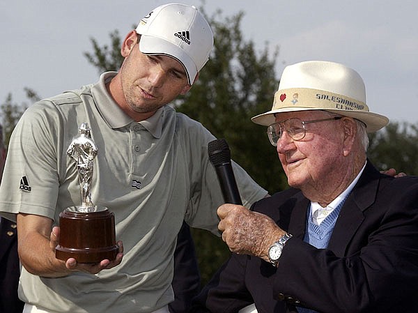 In this May 16, 2004, file photo, Sergio Garcia admires the Byron Nelson trophy as he stands next to Nelson on the 18th green following Garcia's victory at the Byron Nelson Championship in Irving, Texas.