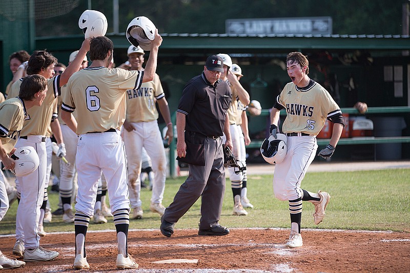 Pleasant Grove's Will Hlavinka celebrates his sixth-inning grand slam to put the Hawks on the board against Canton on Thursday. PG beat the Eagles, 9-0, in Game 1 of the Class 4A Region II area quarterfinal.