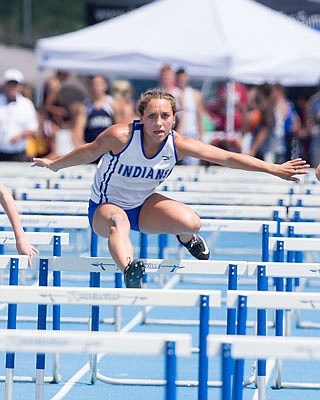 Makenzie Schwartz of Russellville competes in the 100-meter hurdles at the Class 2 sectional meet in last Saturday in Russellville. It is one of four events Schwartz in which Schwartz advanced to state.