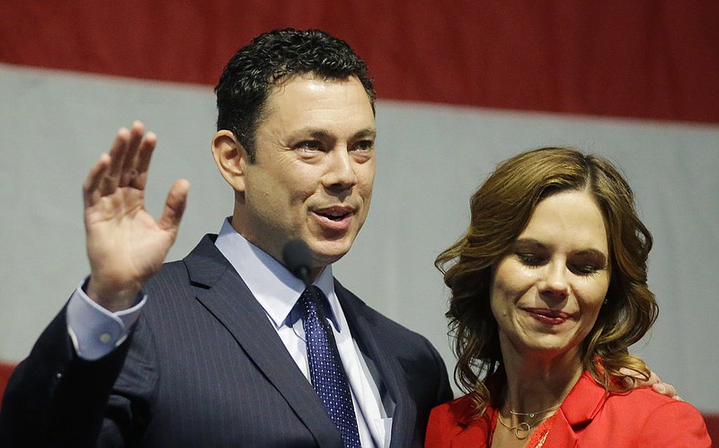 U.S. Rep. Jason Chaffetz waves to the Utah GOP Convention while his wife Julie looks on Saturday, May 20, 2017, in Sandy, Utah. Chaffetz said this week that he's stepping aside from Congress next month during the prime of his career and just as his committee was poised to investigate President Donald Trump's firing of FBI Director James Comey. 