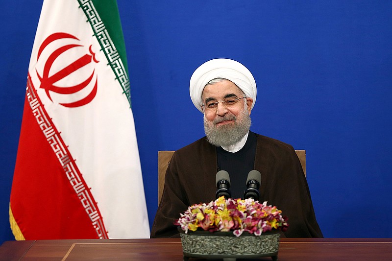 Iranian President Hassan Rouhani attends a televised speech after he won the election, in Tehran, Iran, Saturday, May 20, 2017. Rouhani says that the message of Friday's election that gave him another four-year term is one of Iran living in peace and friendship with the world. 