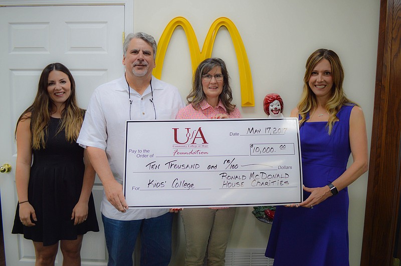 Shown, from left, are Anna Powell, University of Arkansas at Hope-Texarkana Kids' College director; Steve Montgomery and Celia Montgomery of McDonald's; and Jill Bobo, executive director of the UAHT Foundation. Ronald McDonald Children's Charity recently donated $10,000 to UAHT's summer Kid's College program.

