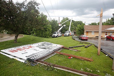 A billboard sits in the a lot adjacent to Linn Motel after severe storms struck in Linn and surrounding areas on Friday, May 19, 2017.