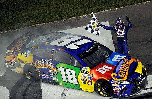 Kyle Busch celebrates Saturday night after winning the NASCAR All-Star race at the Charlotte Motor Speedway in Concord, N.C.