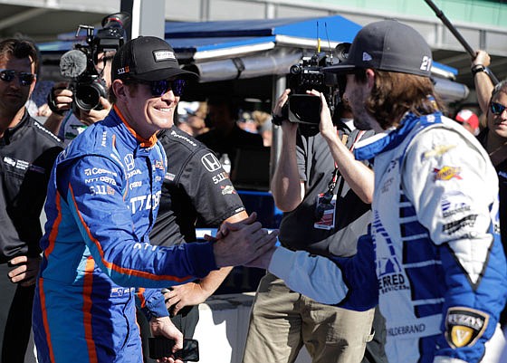 Scott Dixon is congratulated by JR Hildebrand after winning the pole during qualifications Sunday for the Indianapolis 500 at Indianapolis Motor Speedway in Indianapolis.