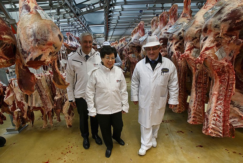 In this Tuesday, April 7, 2015 file photo, World Health Organisation chief Margaret Chan, center, visits the Rungis international market to mark the World Health Day in Rungis, outside Paris, France. WHO routinely spends about $200 million a year on travel, far more than what it doles out to fight some of the biggest problems in public health including AIDS, tuberculosis and malaria, according to internal documents obtained by The Associated Press, published Sunday, May 21, 2017.