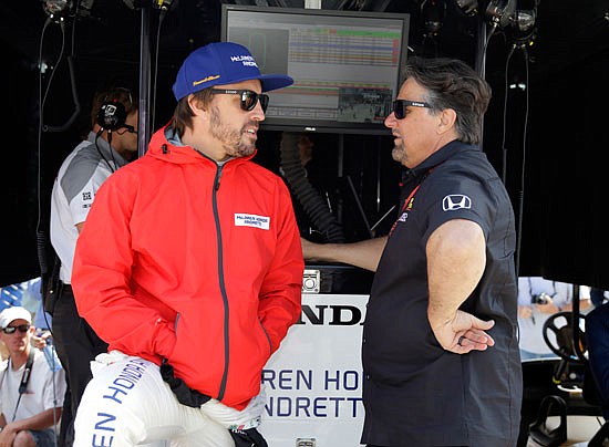 Fernando Alonso talks with car owner Michael Andretti before the start of practice Monday for the Indianapolis 500 at Indianapolis Motor Speedway in Indianapolis.