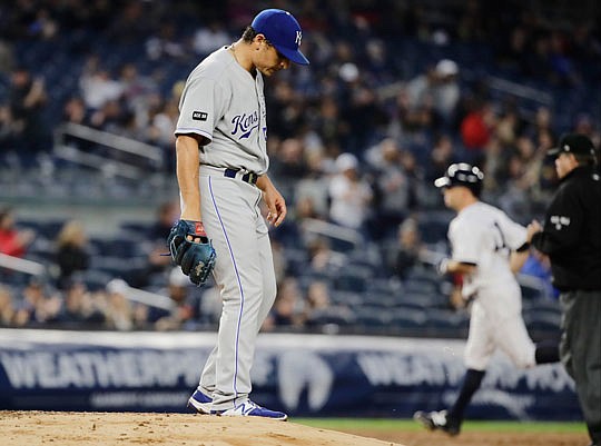 Royals starting pitcher Jason Vargas reacts as Brett Gardner of the Yankees rounds the bases during the third inning of Monday night's game in New York.