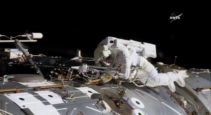 In this NASA provided frame from video, NASA astronaut Jack Fischer works to install antennas while astronaut Peggy Whitson, not pictured, works on repairs Tuesday, May 23, 2017, at the International Space Station.