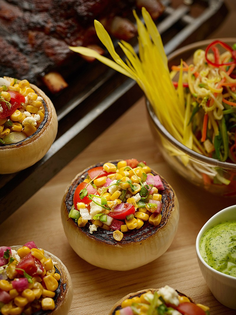 This April 2017 photo provided by The Culinary Institute of America shows Mexican-style corn salad in Hyde Park, N.Y. This dish is from a recipe by The Culinary Institute of America. 