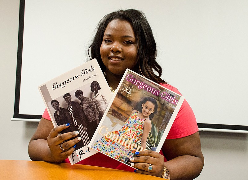 In a May 9, 2017 photo, Ryan High School junior Kennedy McWilliams shows off two issues of her magazine "Gorgeous Girls," in Denton, Texas. She started the magazine to help build self-esteem in young girls. 