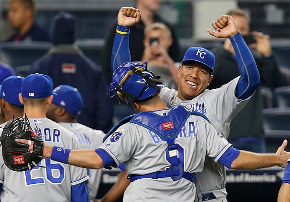 Salvador Perez celebrates with Royals catcher Drew Butera after Tuesday night's 6-2 win against the Yankees in New York.