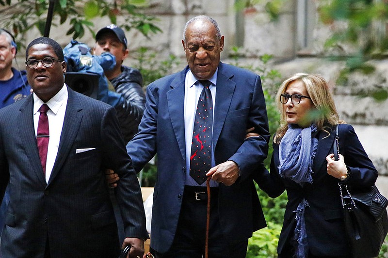 Bill Cosby, center, arrives with one of his attorneys Angela Agrusa, right, for the third day of jury selection in his sexual assault case at the Allegheny County Courthouse, Wednesday, May 24, 2017, in Pittsburgh. The case is set for trial June 5 in suburban Philadelphia. 